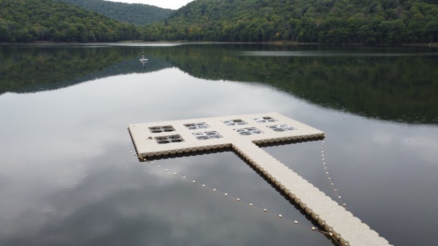 Aerial view of the floating research dock and the environmental survey booey on Lac Hertel.